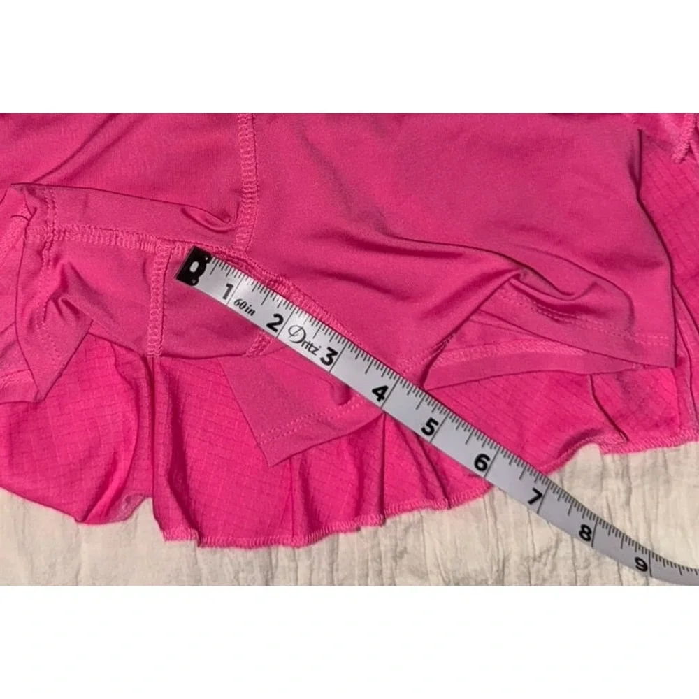 Lucky In Love pink ruffled‎ skort with undershorts and a 4